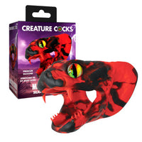 Red and black creature cock with packaging labeled 'Creature Cocks' on a white background