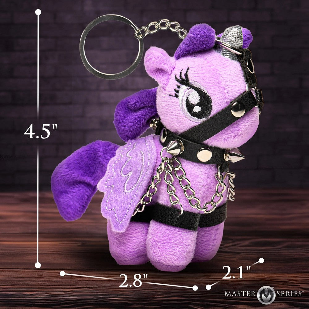 Purple plush keychain with measurements on a wooden surface