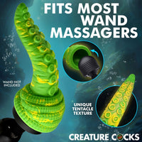 Green tentacle-shaped wand massager with yellow suction cup details, shown against a dark blue underwater-style background with text reading 'FITS MOST WAND MASSAGERS' and 'CREATURE COCKS'. Two circular inset images highlight the interior opening and tentacle texture.