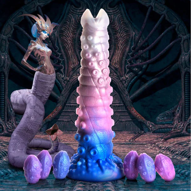 Clear, blue & purple dildo with tentacles and eggs that come out the top with alien creature beside