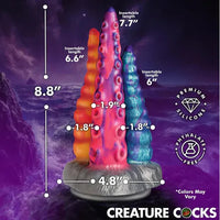 Colorful siliconetentacle dildo with measurement labels on a cosmic background, featuring the brand 'Creature Cocks'.