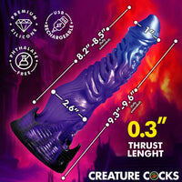 Measurement chart of a purple silicone diabolos thrusting dildo with labeled dimensions on a colorful background, featuring the brand 'Creature Cocks'.