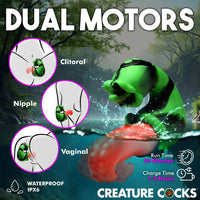 Green creature cock with dual motors labeled for clitoral, nipple, and vaginal stimulation, set against a nature-themed background.