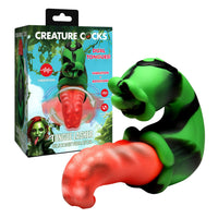 Silicone vibrator with packaging labeled 'Creature Cocks' on a white background