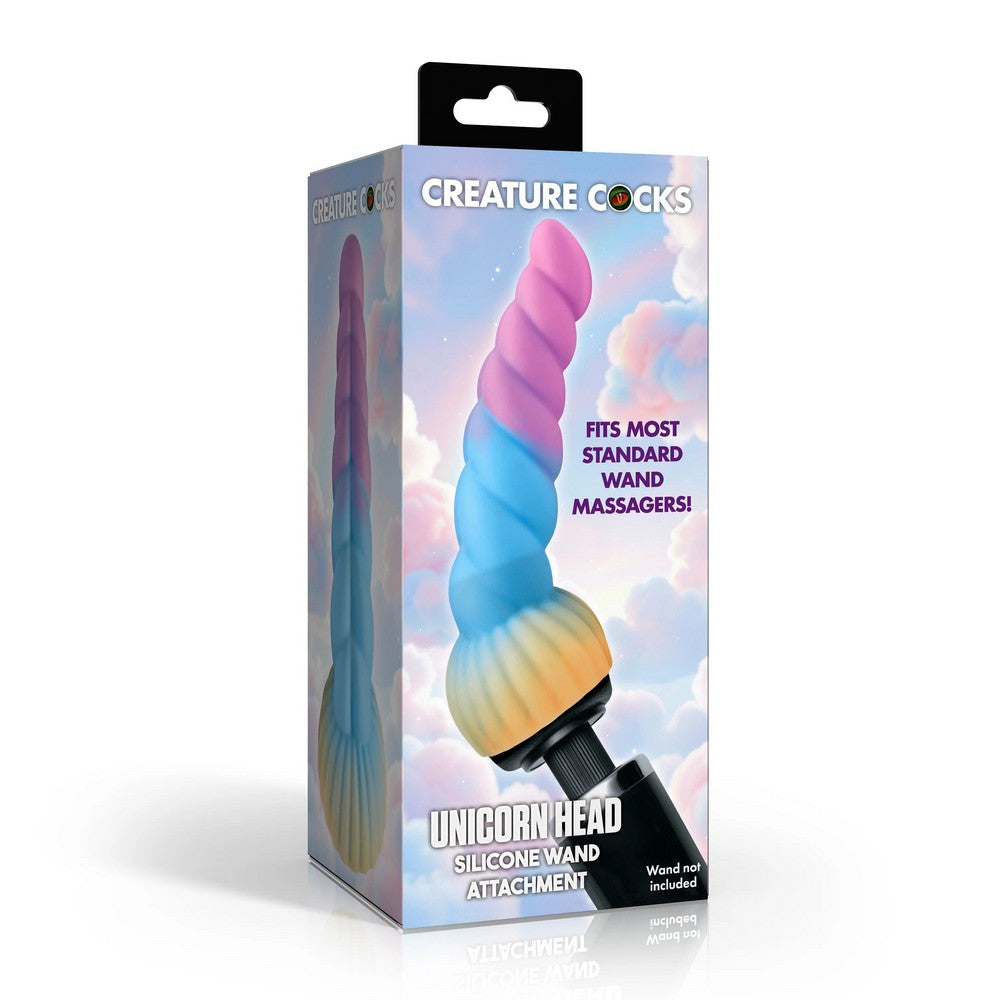 Creature Cocks Unicorn Head Silicone Wand Attachment in its retail packaging, featuring a pastel rainbow spiral design on a white background.