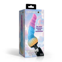 Creature Cocks Unicorn Head Silicone Wand Attachment in its retail packaging, featuring a pastel rainbow spiral design on a white background.