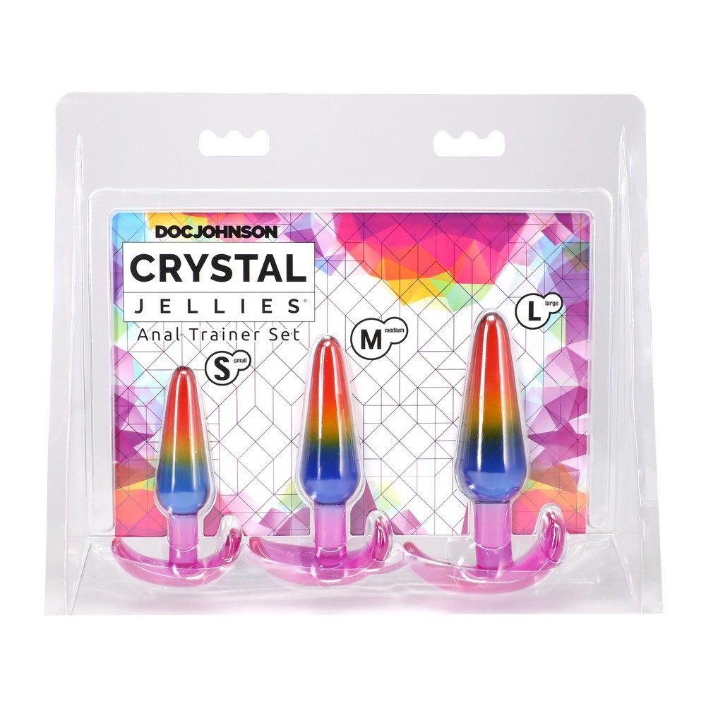Packaged set of rainbow-colored 'Crystal Jellies' anal trainer products by Doc Johnson on a colorful geometric patterned background.