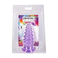 A purple spiral-shaped adult toy inside its clear blister packaging, with a colorful backing card labeled 'Doc Johnson Crystal Jellies Anal Twist 5 inches'.