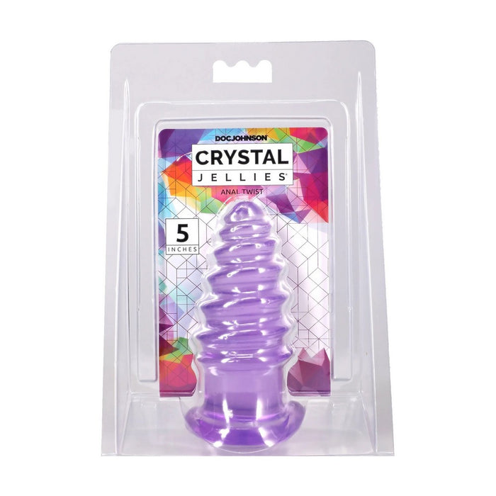 A purple spiral-shaped adult toy inside its clear blister packaging, with a colorful backing card labeled 'Doc Johnson Crystal Jellies Anal Twist 5 inches'.