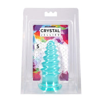 Doc Johnson Crystal Jellies Anal Twist plug in its original clear plastic blister packaging with a colorful geometric 