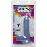 a clear detailed penis shaped dildo with balls and a suction cup, shown in its plastic packaging