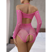 Person wearing a pink mesh bodysuit with sparkles in a bedroom setting