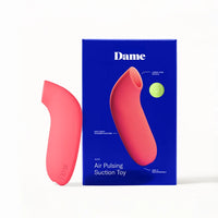 pink clitoral vibrator beside box packaging