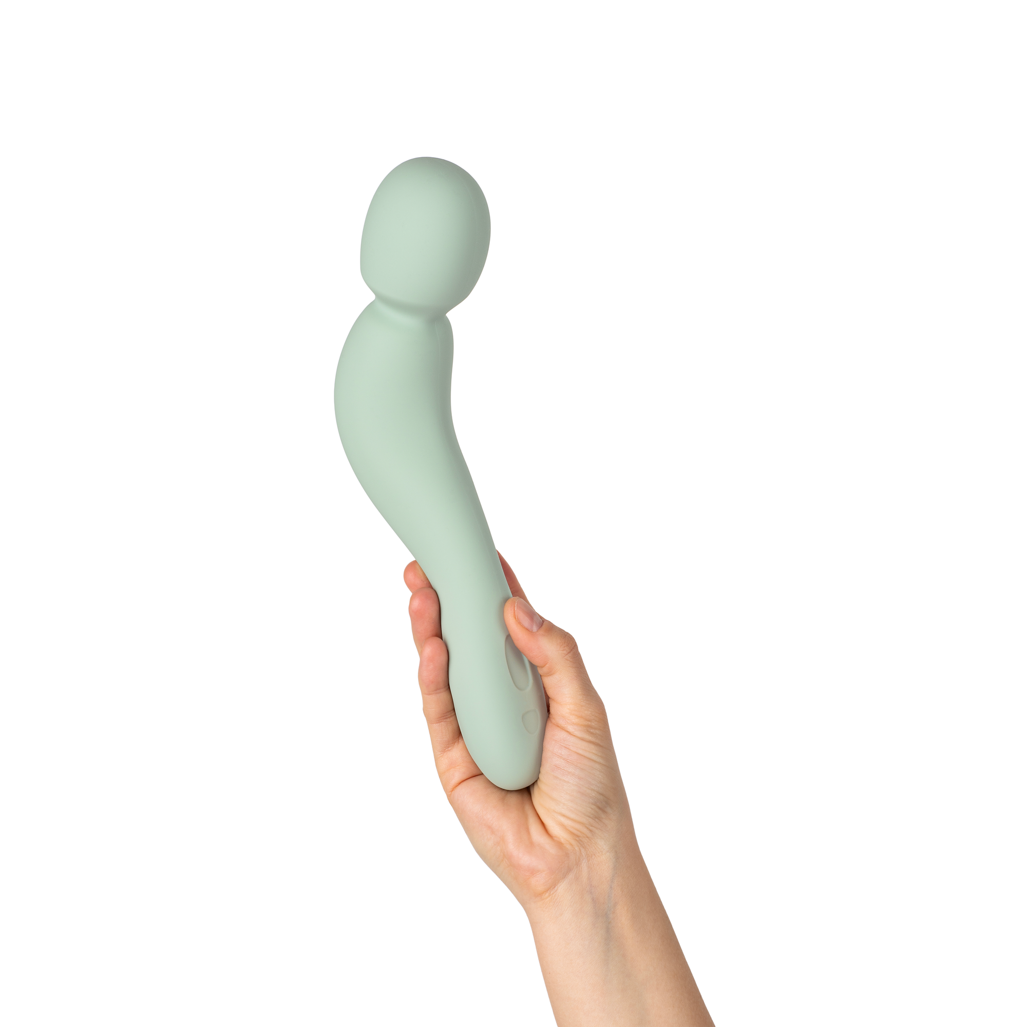 A hand holding a smooth, curved personal massager in a pale mint green color against a solid white background.