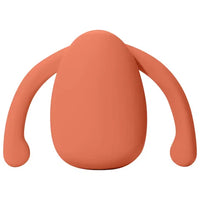 orange silicone clitoral vibrator with handles on a white background