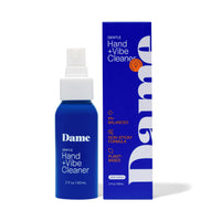 spray bottle of damn hand and vibe cleaner beside box packaging