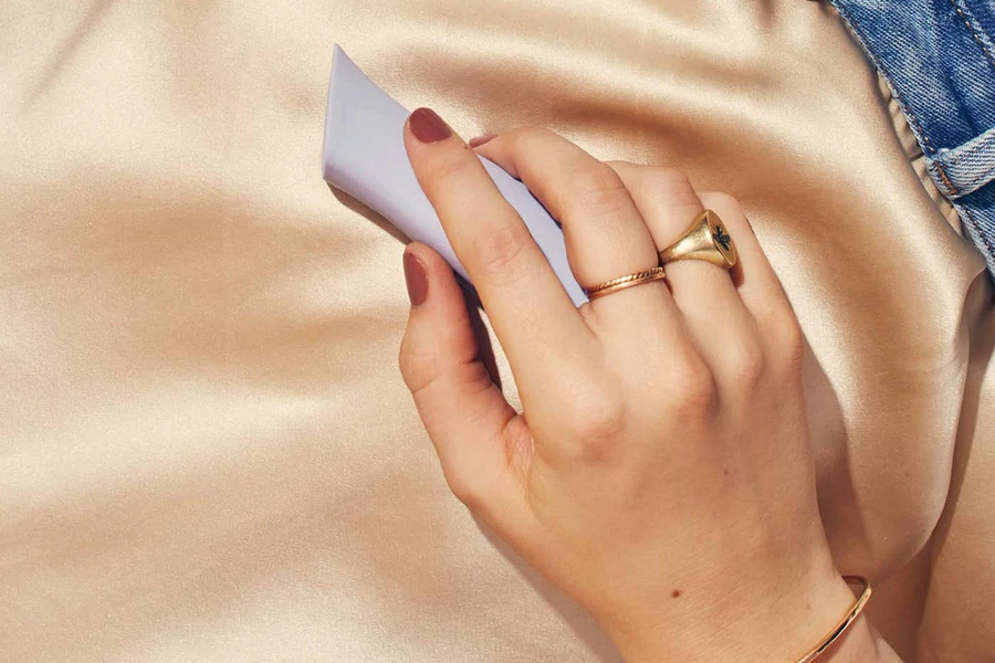 lilac vibrator held in hand against the body