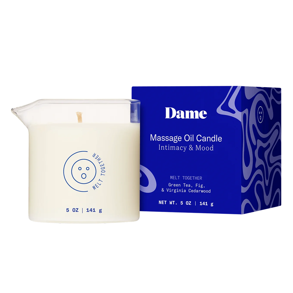 Massage oil candle with blue packaging labeled 'Dame' on a white background