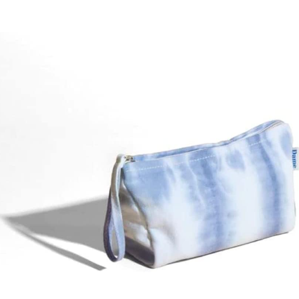 Blue and white tie-dye pouch on a white background