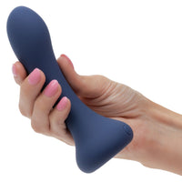 Hand holding a blue deep curve anal probe against a white background