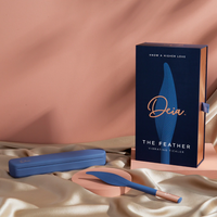 blue feather shaped vibrator beside box packaging