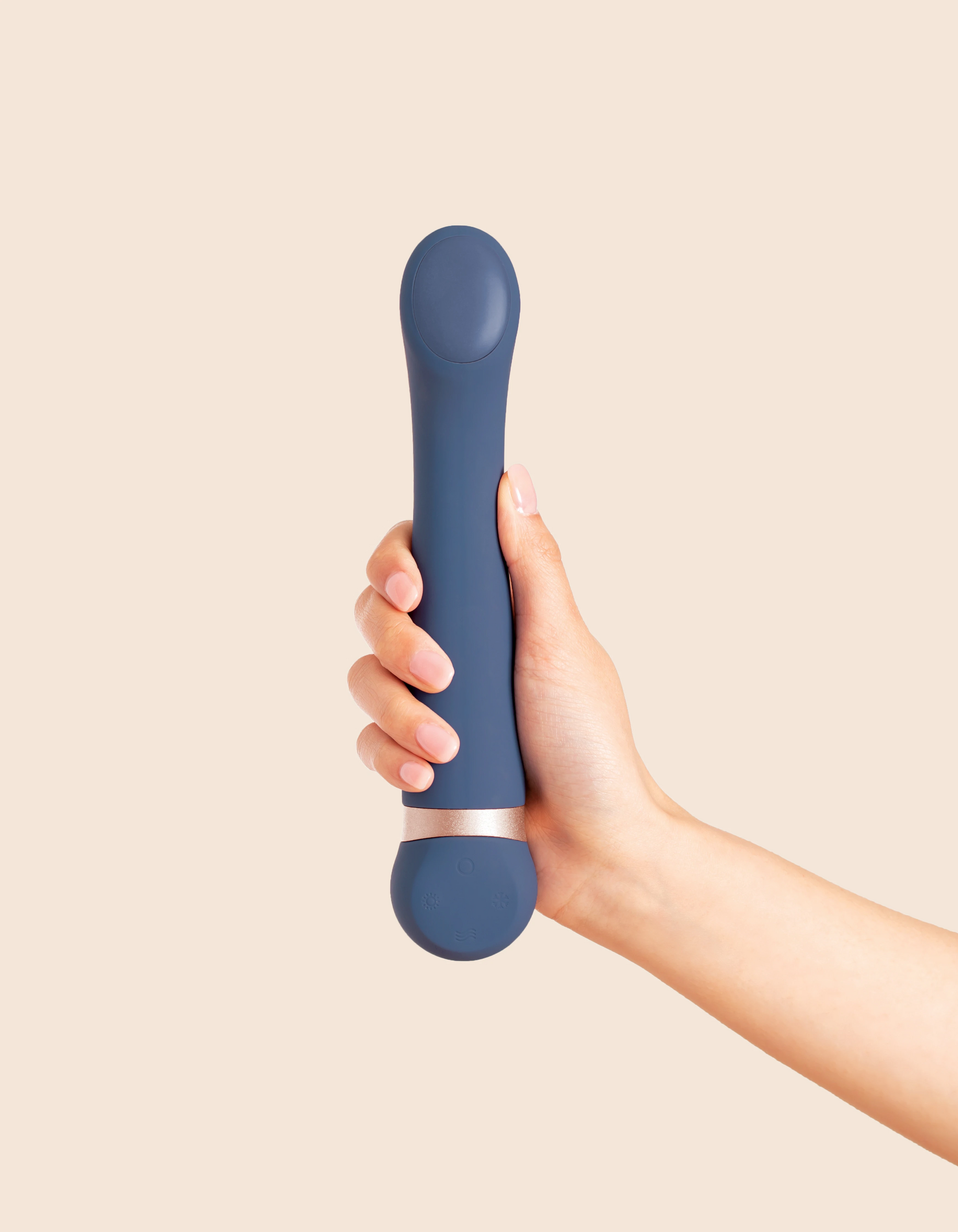 navy blue vibrator held in a hand