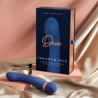 Blue G-Spot massager with packaging on a satin surface