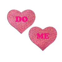 pink glitter heart pasties with do me written in bright pink