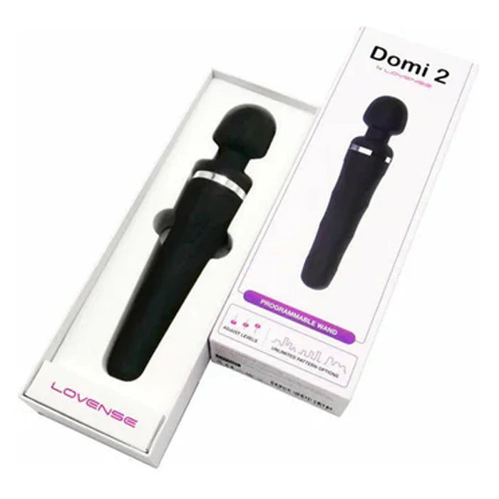 Black handheld wand with 'Domi 2' branding on packaging against a white background