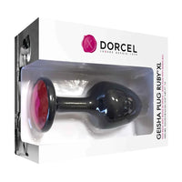 black anal plug with red gem on bottom. on box packaging