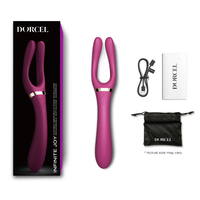 purple vibrator with fork like head. beside box packaging and accessories