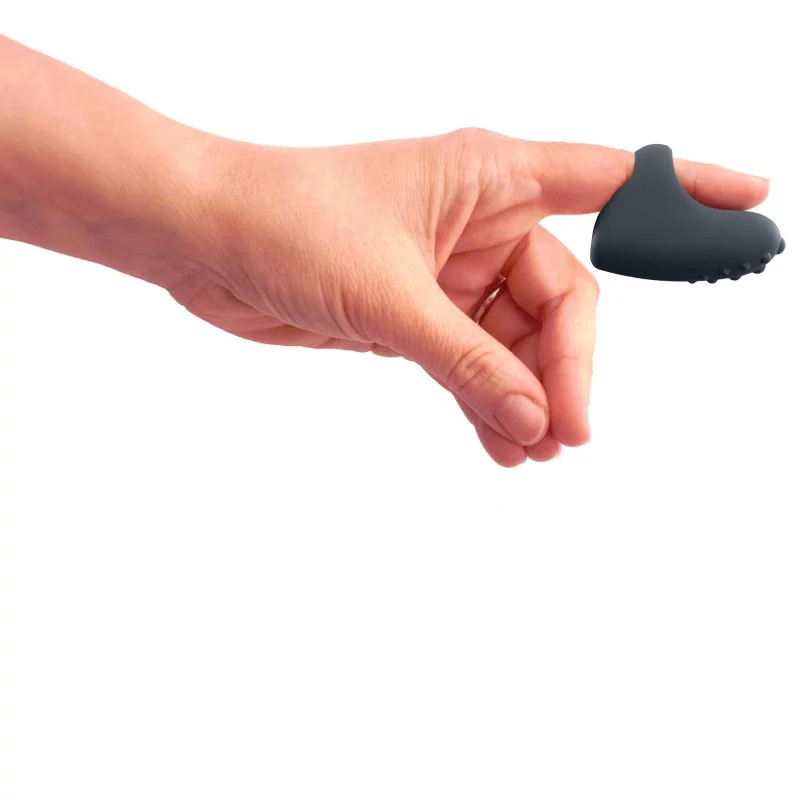 a hand with a finger vibrator on the index finger on white background