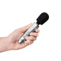 doxy mini massage wand with grey handle and black heat held in hand