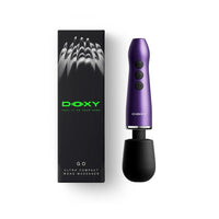A black DOXY GO ultra compact wand massager shown next to its black packaging box with green branding, on a clean white background.