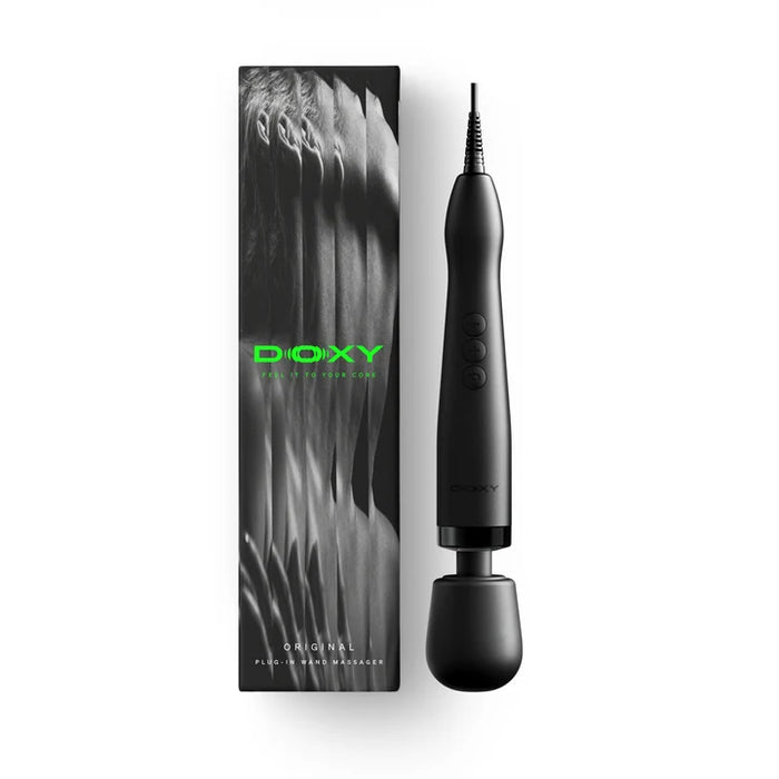 black doxy wand with plug in beside box packaging