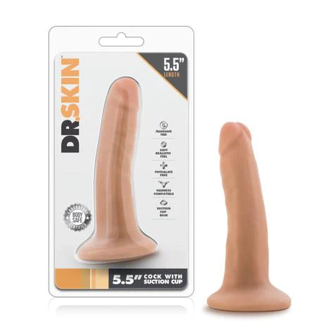 a beige penis shaped dildo with a suction cup base shown next to its plastic packaging
