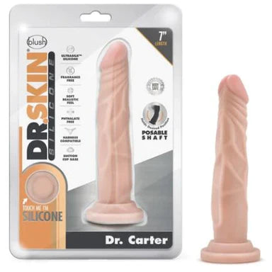 a beige penis shaped dildo with a suction cup base shown next to its plastic packaging