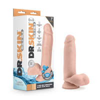 A flesh-toned silicone dildo standing next to its retail box on a clean white background. The packaging features the brand name 'Dr.