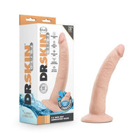 a beige penis shaped dildo with a suction cup base shown next to its display box