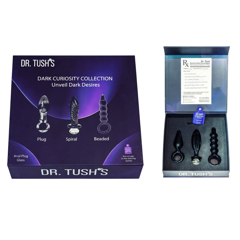 Dr. Tush's Dark Curiosity Collection unveiled dark desires anal plug and spiral set, shown with its purple packaging box and an open inner box displaying the products.