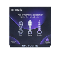 Box packaging for Dr. Tush's Halo of Pleasure Collection, showing three clear glass anal plugs labeled Plug, Spiral, and Beaded on a dark purple and black background.