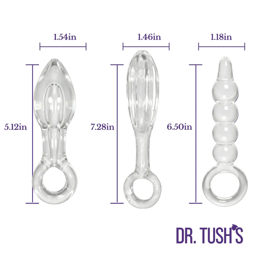 Three clear silicone or glass anal plugs shown side by side with dimension labels and purple measurement lines. The left item is 1.