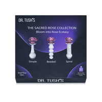 Box packaging for Dr. Tush's The Sacred Rose Collection, showing three glass anal plugs labeled Simple, Beaded, and Spiral with purple rose-shaped tops on a dark navy and purple background.