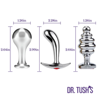 Three metallic anal plug variants with dimension callouts and purple measurement lines on a white background, plus the brand name DR. TUSH'S at the bottom right.