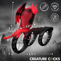 Red and black silicone dragon flight cock ring with measurements and branding on a dark background