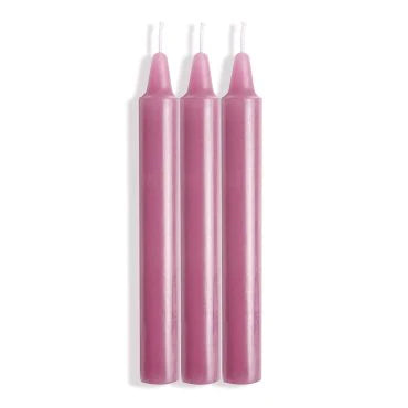 three pink candles with white wicks