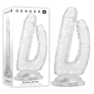 clear jelly dual penis with suction base next to box