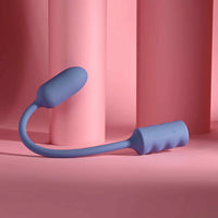 Blue handheld vibrating egg on a pink background