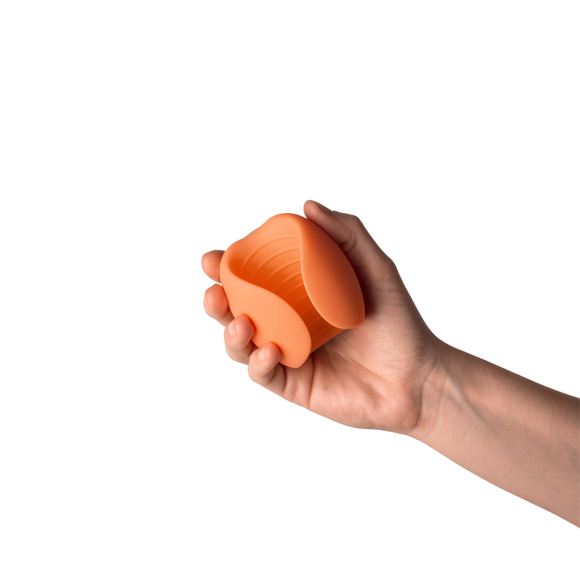 peach masturbator held in hand