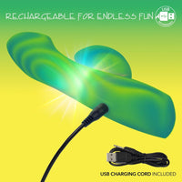 Green vibrator with USB charging cord on a yellow and green gradient background